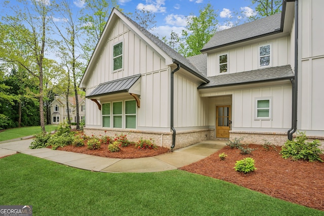 4426 Oxburgh Park, Flowery Branch, GA 30542 - modern inspired farmhouse featuring board and batten siding, roof with shingles, and a front yard