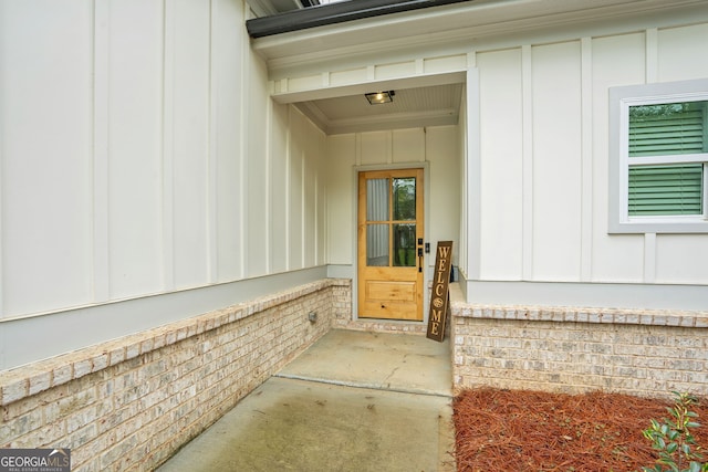 property entrance with board and batten siding