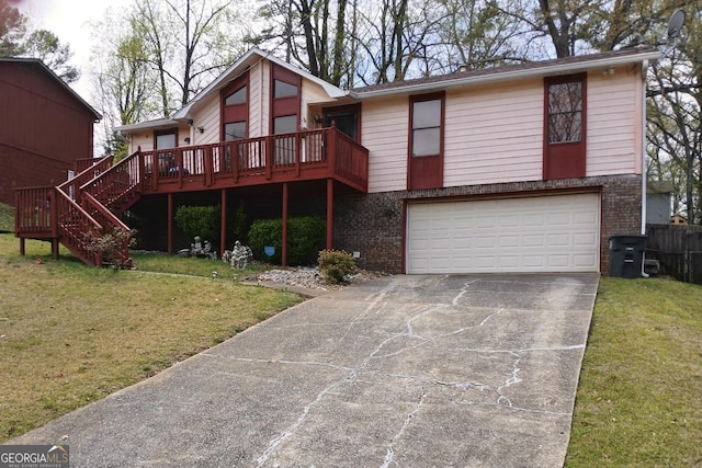 1114 Suncrest Ln, Birmingham, AL 35215 - view of front facade with brick siding, an attached garage, driveway, and a front lawn