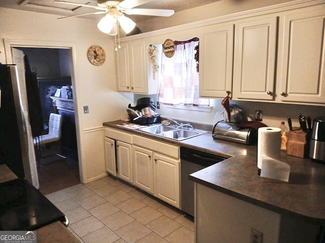 1114 Suncrest Ln, Birmingham, AL 35215 - kitchen featuring ceiling fan, light tile patterned flooring, a sink, dark countertops, and stainless steel appliances
