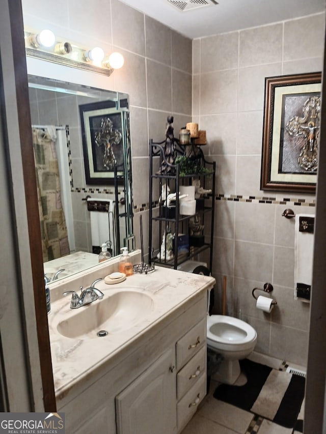 1114 Suncrest Ln, Birmingham, AL 35215 - bathroom with vanity, tile patterned flooring, a shower with curtain, toilet, and tile walls
