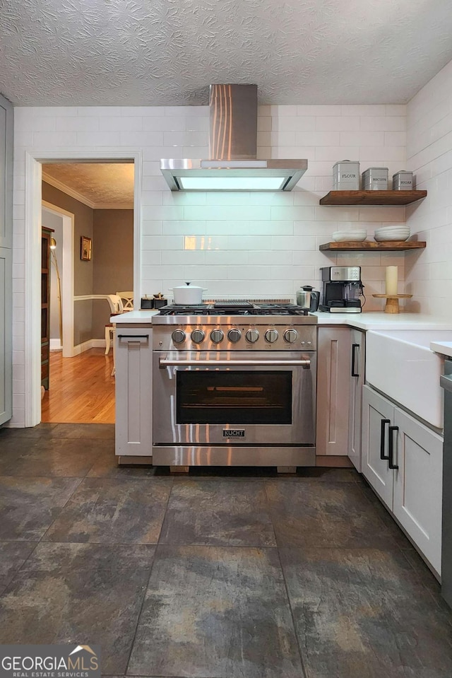 4295 S Berkeley Lake Rd NW, Berkeley Lake, GA 30096 - kitchen with stainless steel range, wall chimney exhaust hood, light countertops, crown molding, and open shelves