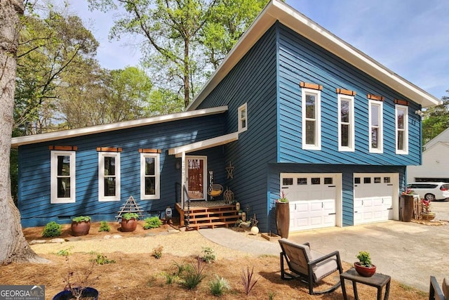4295 S Berkeley Lake Rd NW, Berkeley Lake, GA 30096 - view of front of property with driveway and an attached garage