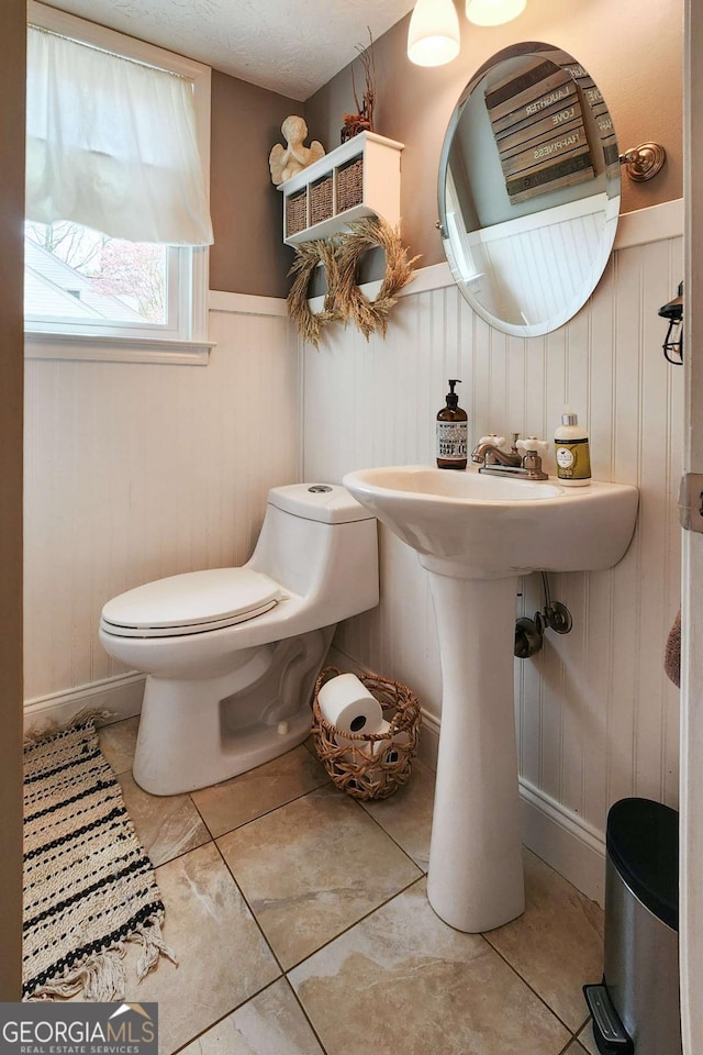 4295 S Berkeley Lake Rd NW, Berkeley Lake, GA 30096 - bathroom with tile patterned floors and wainscoting