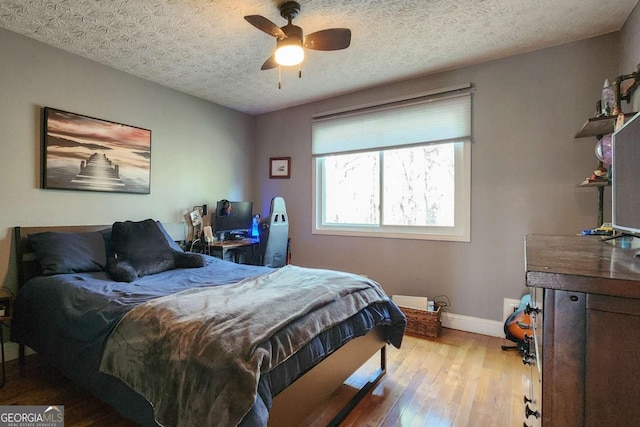 4295 S Berkeley Lake Rd NW, Berkeley Lake, GA 30096 - bedroom with wood-type flooring and ceiling fan
