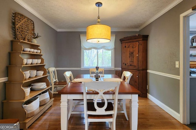 4295 S Berkeley Lake Rd NW, Berkeley Lake, GA 30096 - dining space with a textured ceiling, wood finished floors, and ornamental molding