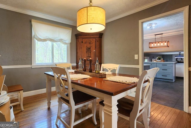 4295 S Berkeley Lake Rd NW, Berkeley Lake, GA 30096 - dining area with hardwood / wood-style flooring and ornamental molding