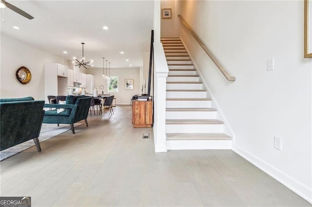 2029 Memorial Dr Unit 32, Atlanta, GA 30317 - stairs featuring recessed lighting, a ceiling fan, a chandelier, and baseboards