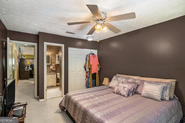 105 Governors Dr, Forest Park, GA 30297 - bedroom with ceiling fan, a textured ceiling, a closet, light colored carpet, and visible vents