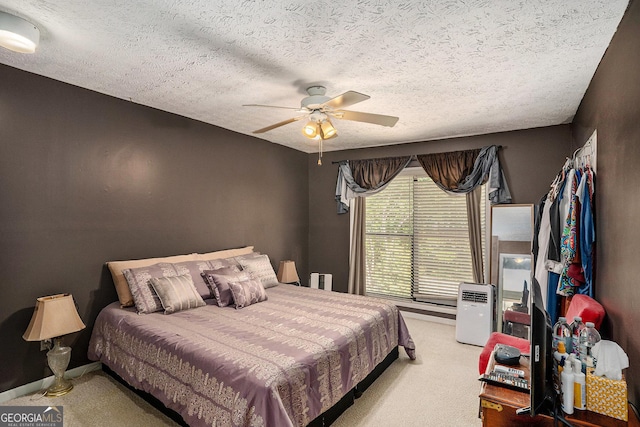 105 Governors Dr, Forest Park, GA 30297 - carpeted bedroom featuring a textured ceiling and ceiling fan