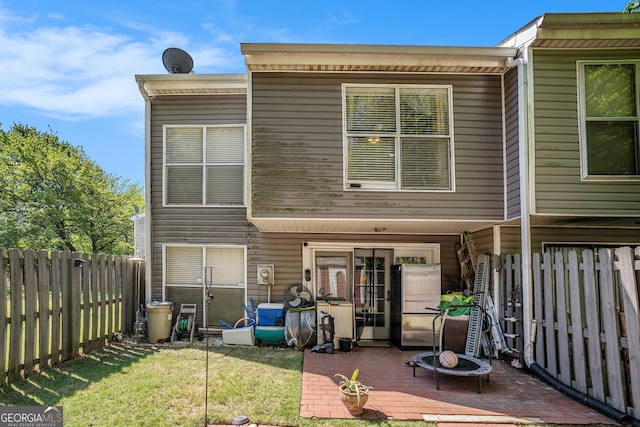 105 Governors Dr, Forest Park, GA 30297 - rear view of house featuring a yard, a fenced backyard, and a patio