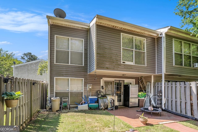 105 Governors Dr, Forest Park, GA 30297 - rear view of house with a patio area, a fenced backyard, and a yard