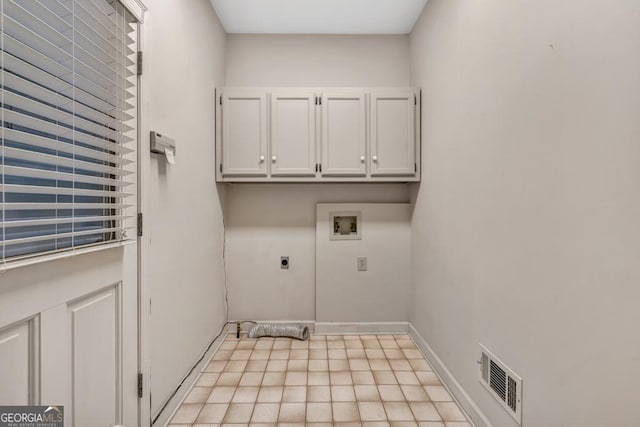 washroom featuring visible vents, hookup for a washing machine, baseboards, hookup for an electric dryer, and cabinet space