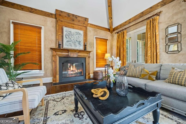 1462 Georgia Club Dr, Statham, GA 30666 - living area with french doors, a glass covered fireplace, and wood finished floors