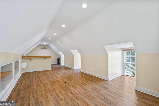 1462 Georgia Club Dr, Statham, GA 30666 - bonus room featuring baseboards, light wood-style floors, lofted ceiling, and recessed lighting