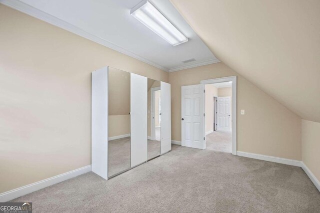 1462 Georgia Club Dr, Statham, GA 30666 - bonus room with baseboards, lofted ceiling, and carpet floors