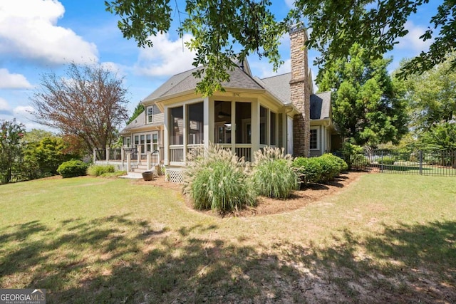 1462 Georgia Club Dr, Statham, GA 30666 - rear view of house featuring a sunroom, fence, a shingled roof, a yard, and a chimney