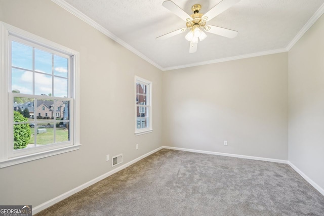 740 Trillium Ln, Lilburn, GA 30047 - carpeted empty room with healthy amount of natural light, baseboards, crown molding, and ceiling fan