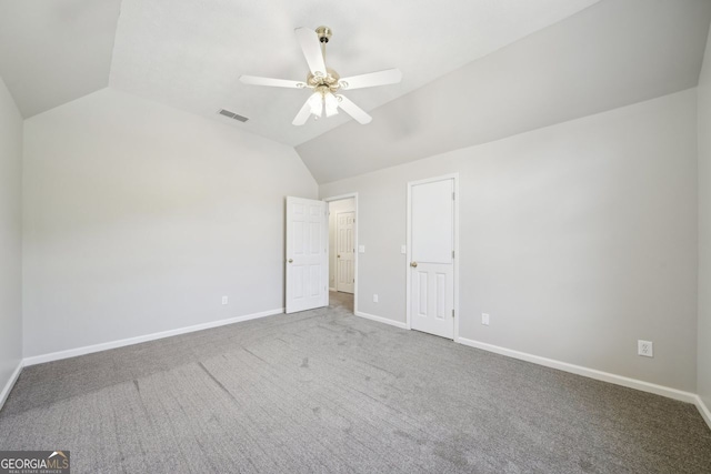 740 Trillium Ln, Lilburn, GA 30047 - unfurnished bedroom with lofted ceiling, carpet, baseboards, and a ceiling fan