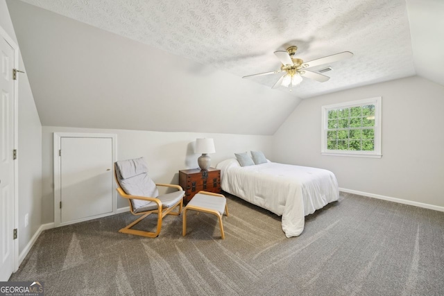 740 Trillium Ln, Lilburn, GA 30047 - carpeted bedroom with baseboards, lofted ceiling, ceiling fan, and a textured ceiling