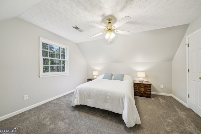 740 Trillium Ln, Lilburn, GA 30047 - bedroom featuring vaulted ceiling, baseboards, carpet, and a ceiling fan