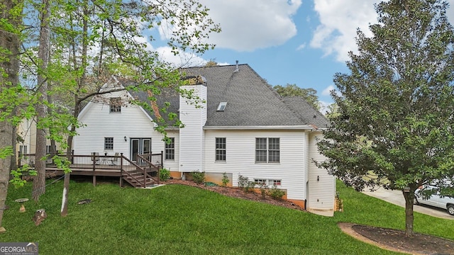 740 Trillium Ln, Lilburn, GA 30047 - rear view of house with a wooden deck, a yard, a chimney, and a shingled roof