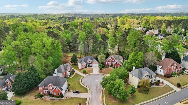 740 Trillium Ln, Lilburn, GA 30047 - aerial perspective of suburban area with a forest