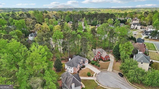 740 Trillium Ln, Lilburn, GA 30047 - aerial overview of property's location featuring nearby suburban area and a forest