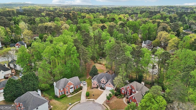 740 Trillium Ln, Lilburn, GA 30047 - aerial overview of property's location featuring a forest and nearby suburban area
