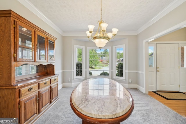 740 Trillium Ln, Lilburn, GA 30047 - entrance foyer featuring a chandelier, a textured ceiling, light wood-type flooring, baseboards, and crown molding