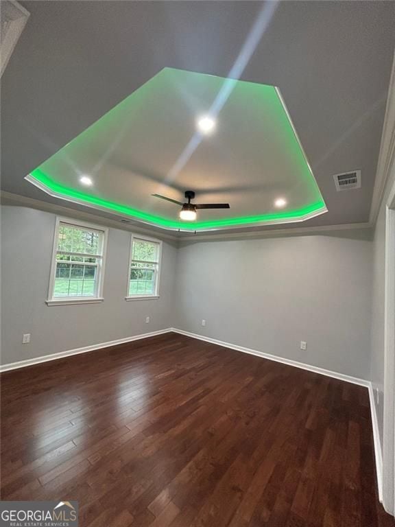 4321 Austell Powder Springs Rd SW, Powder Springs, GA 30127 - unfurnished room featuring a raised ceiling, wood finished floors, and ceiling fan