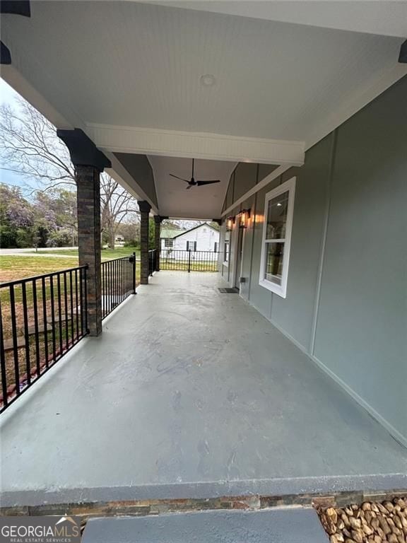4321 Austell Powder Springs Rd SW, Powder Springs, GA 30127 - covered porch with a ceiling fan