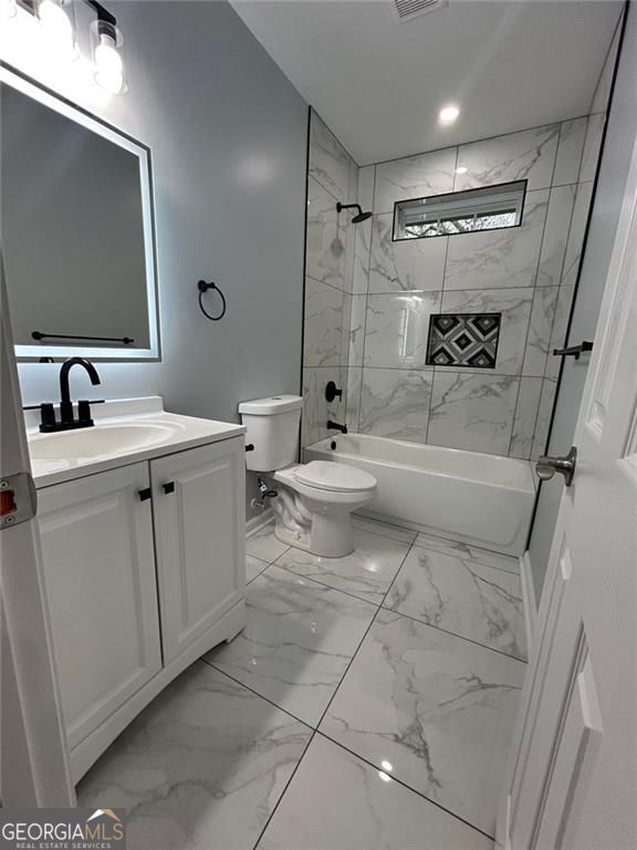 4321 Austell Powder Springs Rd SW, Powder Springs, GA 30127 - bathroom with marble finish floors, vanity, and shower / bath combination