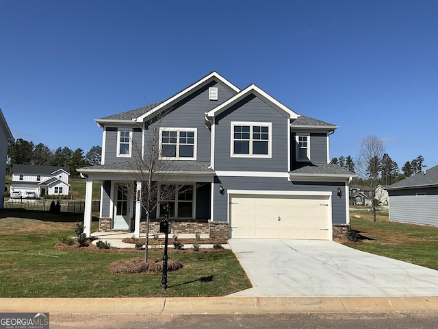 view of front of home featuring a front yard, stone siding, concrete driveway, fence, and an attached garage
