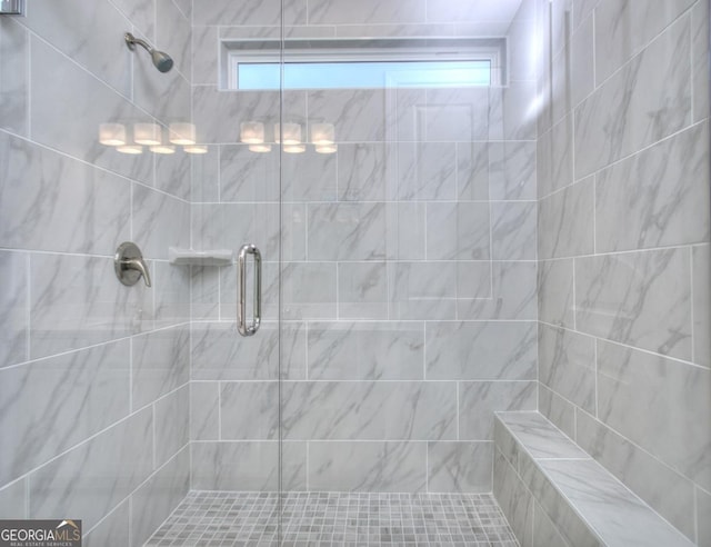 bathroom with a shower stall