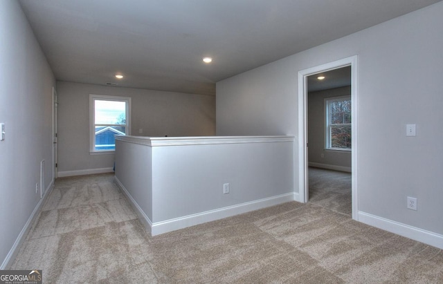 carpeted spare room with baseboards and recessed lighting