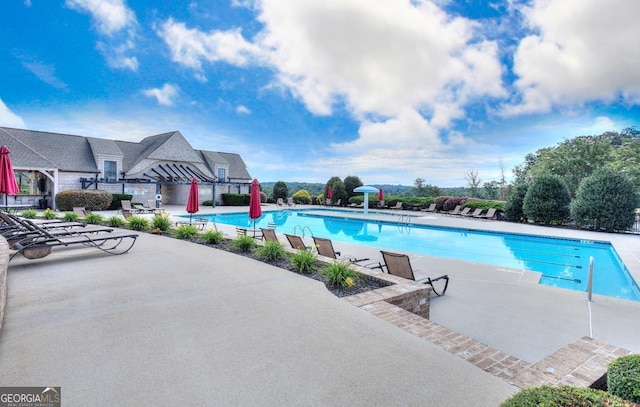 pool featuring a patio area