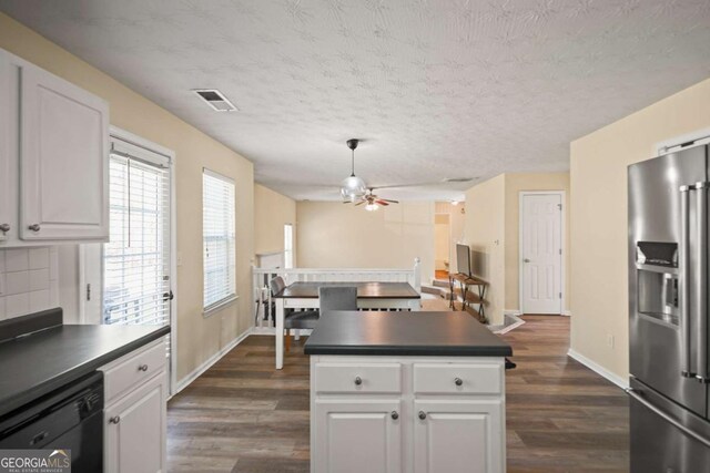 kitchen featuring stainless steel fridge with ice dispenser, black dishwasher, dark countertops, white cabinets, and ceiling fan