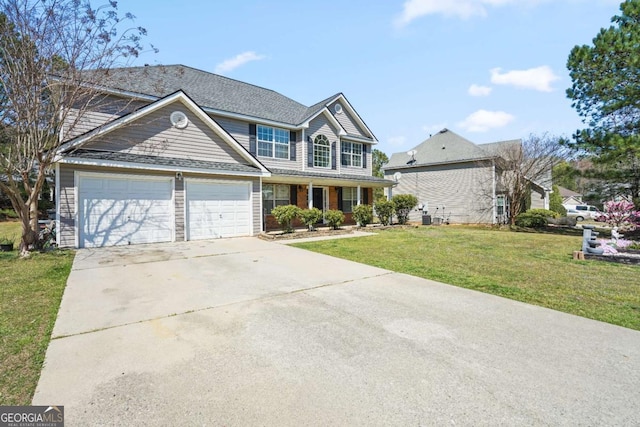 traditional-style house featuring cooling unit, a front yard, driveway, and a garage