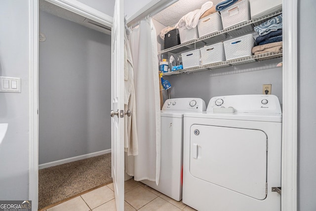 10 Powder Dr, Dallas, GA 30157 - washroom with washer and clothes dryer, light tile patterned floors, light carpet, and baseboards