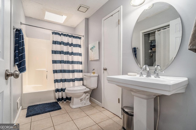 10 Powder Dr, Dallas, GA 30157 - full bath featuring a skylight, toilet, tile patterned floors, shower / bath combo, and baseboards