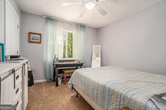 10 Powder Dr, Dallas, GA 30157 - bedroom featuring a textured ceiling, light carpet, baseboards, and a ceiling fan