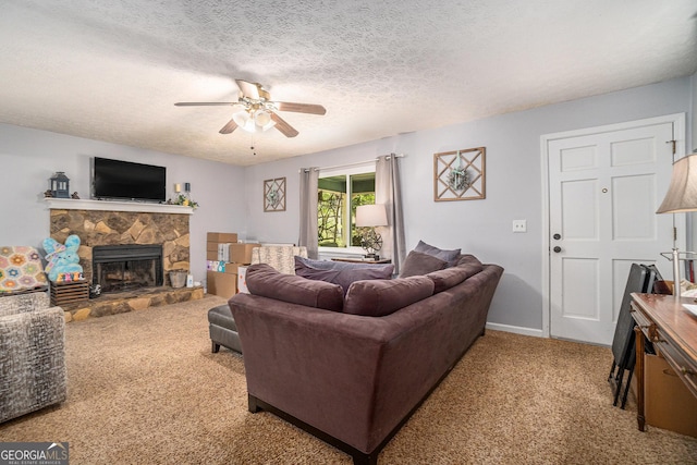 10 Powder Dr, Dallas, GA 30157 - carpeted living room with a ceiling fan, a textured ceiling, a stone fireplace, and baseboards