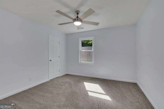 9415 Martin Rd, Roswell, GA 30076 - carpeted spare room with a ceiling fan and baseboards