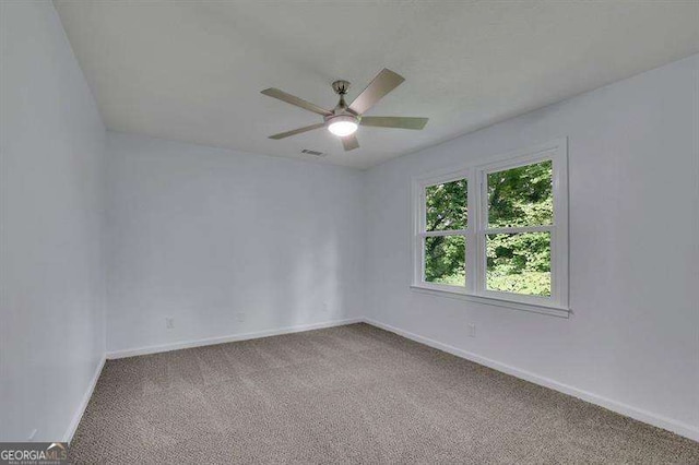 9415 Martin Rd, Roswell, GA 30076 - carpeted spare room with ceiling fan and baseboards