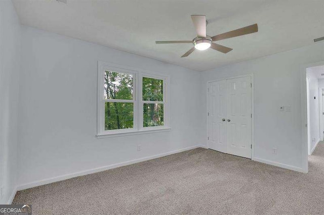 9415 Martin Rd, Roswell, GA 30076 - unfurnished bedroom featuring carpet flooring, a closet, and ceiling fan