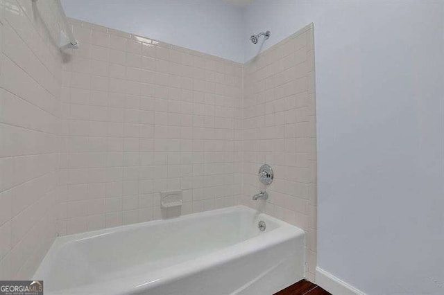 9415 Martin Rd, Roswell, GA 30076 - bathroom with shower / bathtub combination and wood finished floors