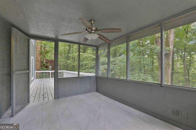 9415 Martin Rd, Roswell, GA 30076 - unfurnished sunroom featuring ceiling fan and healthy amount of natural light