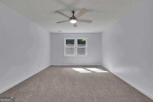 9415 Martin Rd, Roswell, GA 30076 - carpeted empty room featuring a ceiling fan and baseboards