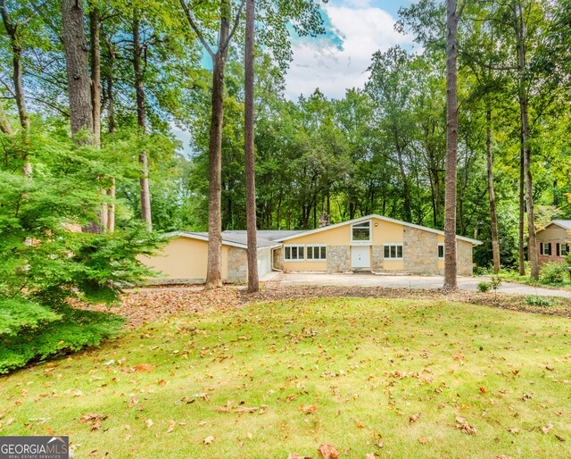 247 Old Timber Rd, Lawrenceville, GA 30046 - view of front of property with stone siding and a front lawn